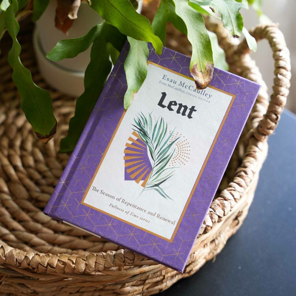 Lent book placed on a wicker basket next to a plant